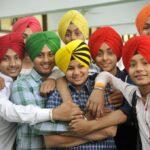 LUDHIANA, INDIA - APRIL 13: Sikh youth participating in a turban tying competition held at Sarabha Nagar Gurudwara on the occasion of Baisakhi festival, on April 13, 2017 in Ludhiana, India. Baisakhi is a historical and religious festival in Sikhism. It is usually celebrated on April 13 or 14 every year. Baisakhi marks the Sikh New Year and commemorates the formation of Khalsa Panth of warriors under Guru Gobind Singh in 1699. It is additionally a spring harvest festival for the Sikhs. (Photo by Gurminder Singh/Hindustan Times via Getty Images)